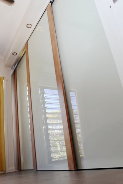 Tasmanian Oak Timber Closet Doors with white glass panels