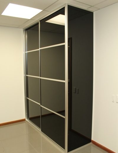 Office Cupboard with Multi Panel Black Glass Doors and nib wall