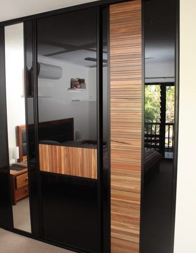 Master Bedroom Timber Louvre Sliding Doors and black glass