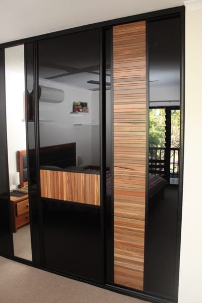 Master Bedroom Timber Louvre Sliding Doors and black glass