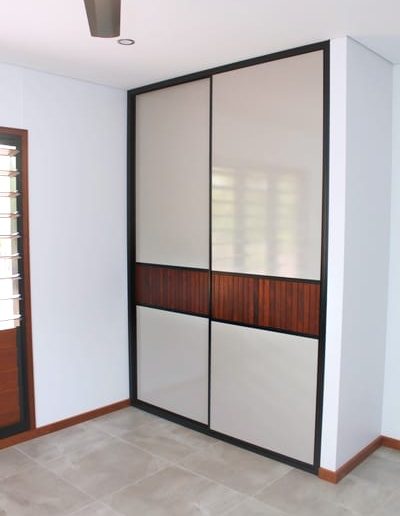 Bedroom Louvre Style Sliding Doors with cement tile floors and timber skirts