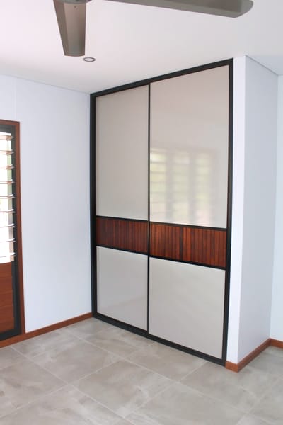 Bedroom Louvre Style Sliding Doors with cement tile floors and timber skirts