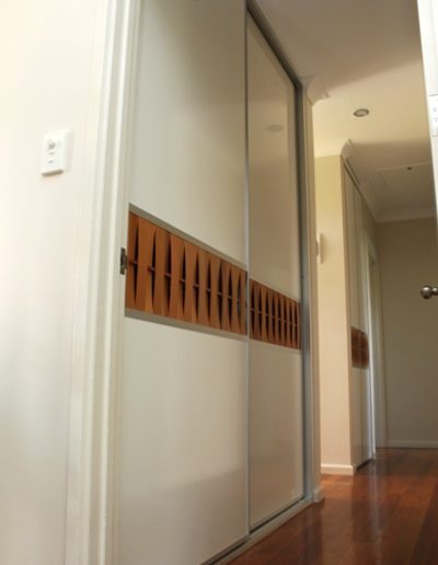 Hallway Cupboard with western red cedar insert into sliding door