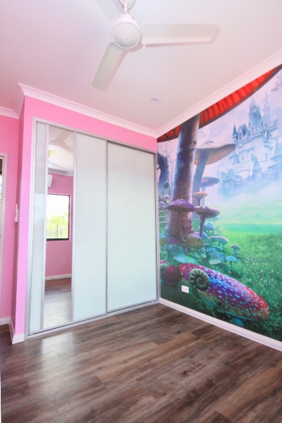 Girls Bedroom With Pink Walls and sliding glass doors