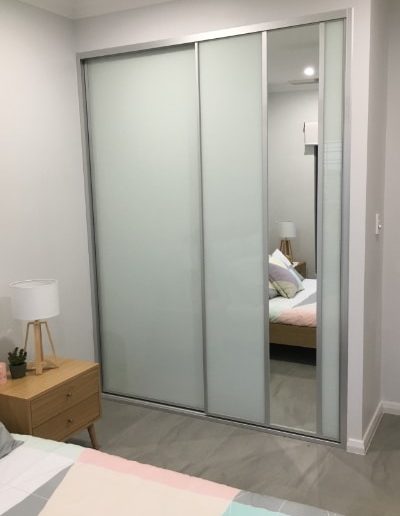 Bedroom Glass Sliding Doors with vertical mirror and grey tile