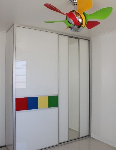 Kid's room Sliding Doors featuring lego panels and matching fan