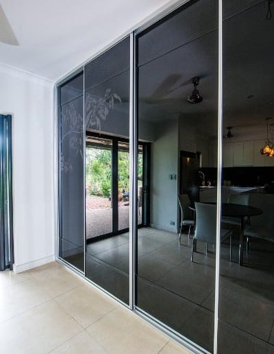 Large Sliding Kitchen Doors black glass featuring Bloodwood blossom picture
