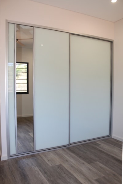 White Glass Sliding Doors with silver mist plank floor boards