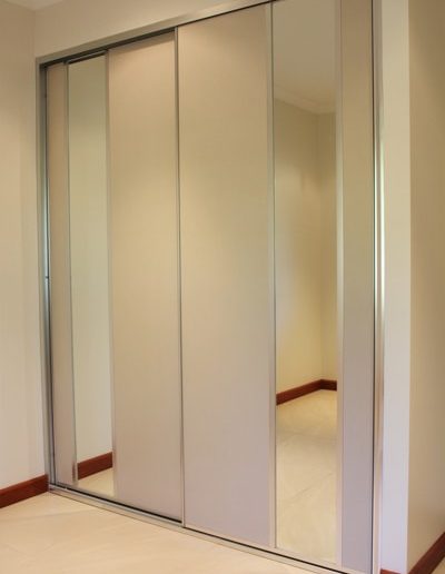 Sliding Bedroom Doors with beige panel and mirror insert panels