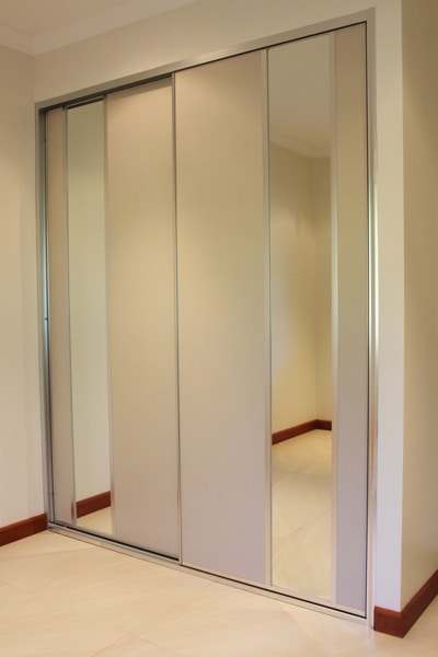 Sliding Bedroom Doors with beige panel and mirror insert panels