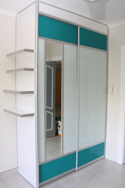 Closet Wardrobe Sliders with Aqua mesh panels and vertical mirror
