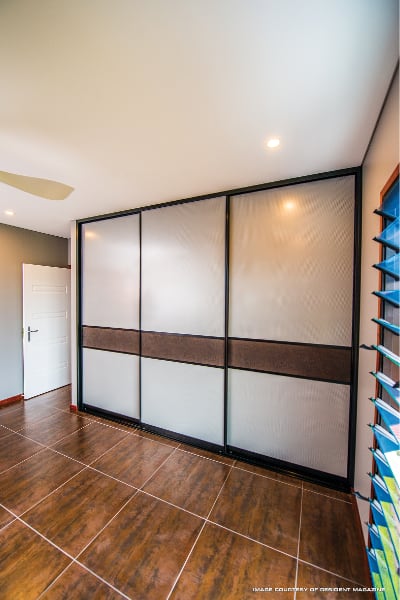 Cupboard Sliding Doors with Mesh panels and crocodile wallpaper