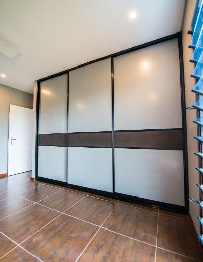Bedroom Sliding Doors with mesh panels and crocodile wall paper