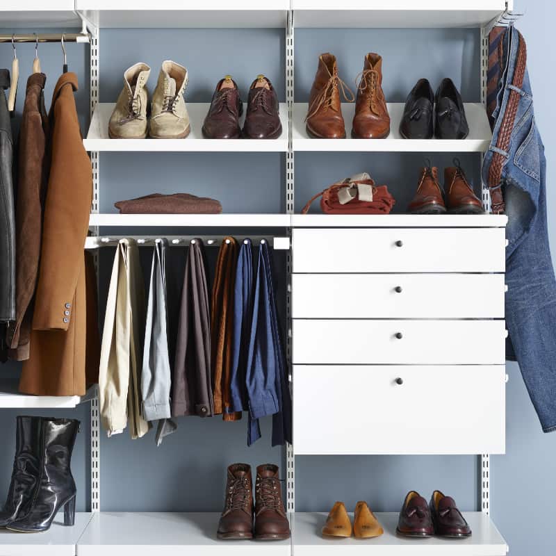 walk in closet with drawers and shoe racks