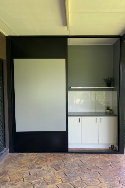 Out side laundry cupboard with ventilated sliding doors open